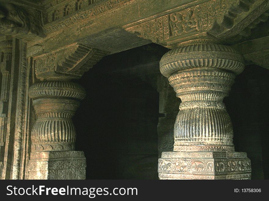 Beautifully carved stone pillars at cave temple in Badami, Karnataka, India, Asia