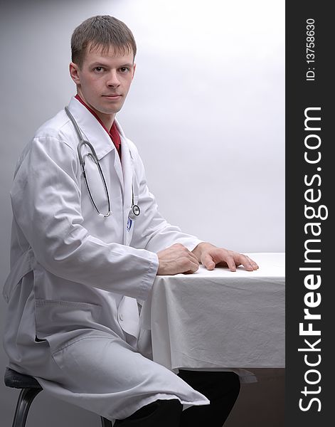 Portrait of young doctor with phonendoscope