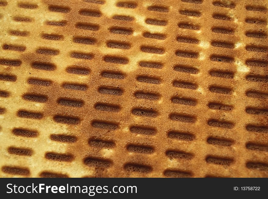 A freshly baked waffle - can be used as a background. A freshly baked waffle - can be used as a background