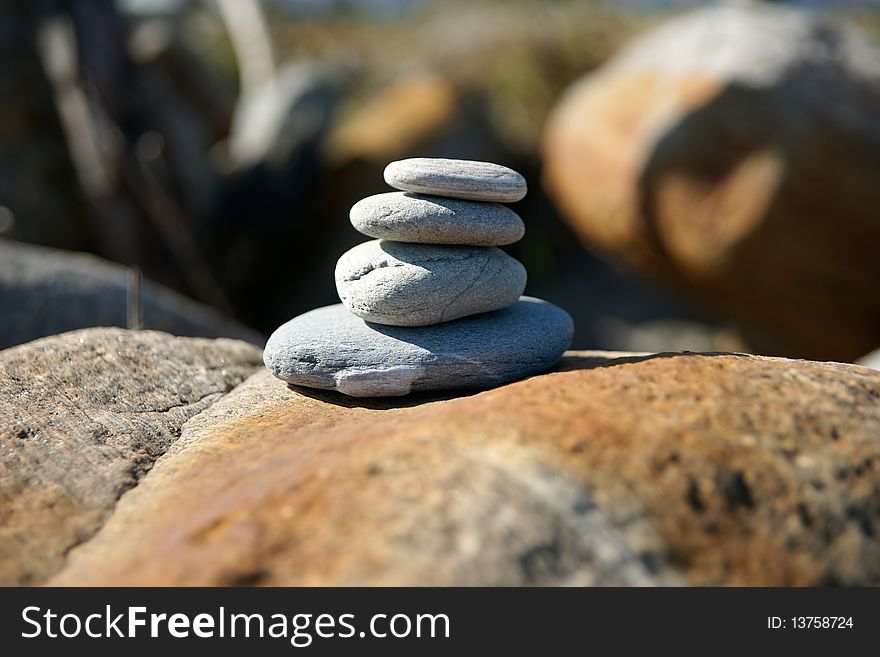 Stones stack, balanced four high. Stones stack, balanced four high