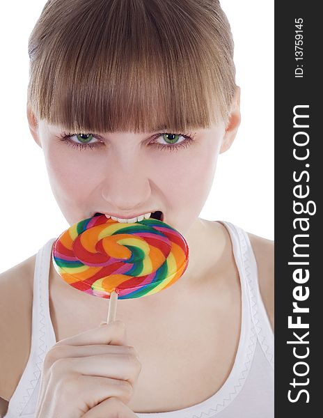 Bright picture of hungry blondie with color lollipop. Bright picture of hungry blondie with color lollipop