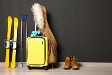 Free Suitcase, Jacket And Skis On Floor Against Black Wall Royalty Free Stock Image - 137524136