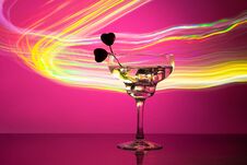 Glass With A Cocktail And Two Hearts. Valentine`s Day And Wedding Concept Royalty Free Stock Images