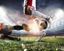 Soccer Players With Soccerball At The Stadium During The Match Royalty Free Stock Photography