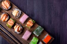 Assortment Of Baked And Fresh Sushi Rolls On A Wooden Board Royalty Free Stock Images Assortment Of Baked And Fresh Sushi Rolls On A Wooden Board Royalty Free Stock Images