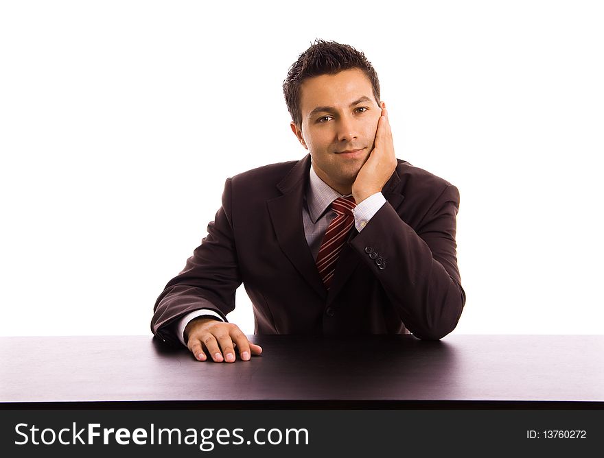 Young business man on a desk, isolated on white