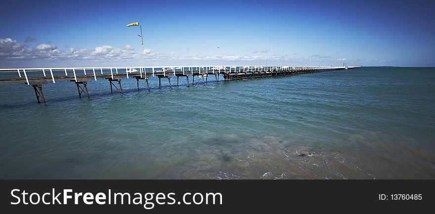 Long pier stretching into the sea