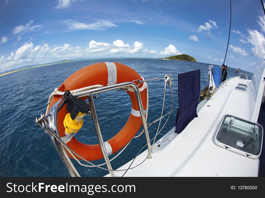 Lifesaver on a sailboat on the ocean near the island