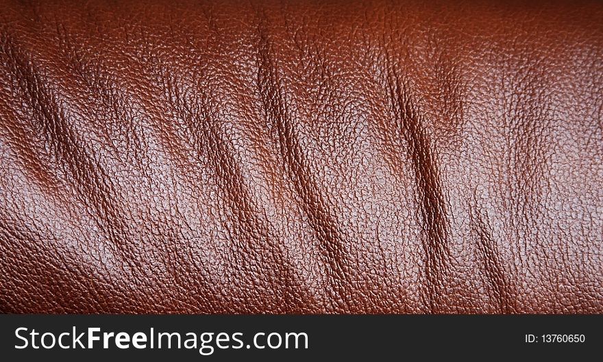This is a close-up of a business chair with detail of the leather. This is a close-up of a business chair with detail of the leather