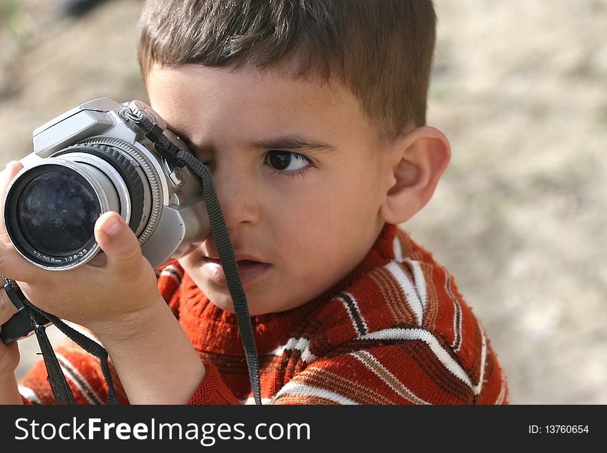 Cute little machine, view photos of a child. Cute little machine, view photos of a child