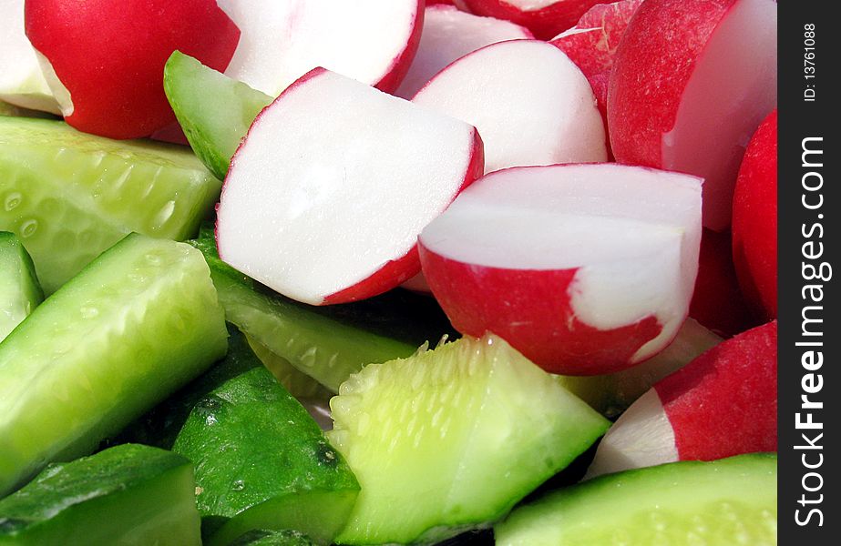 Fresh vegetables: cutted red radish and cucumbers