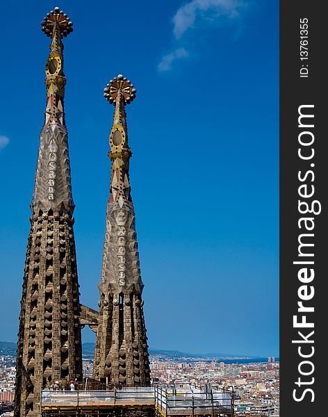 Over the top of the pinnacle of Sagrada Familia in Barcelona, Spain