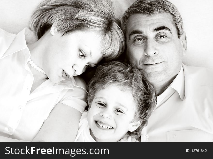 Happy family home: father, mother and - black and white photo. Happy family home: father, mother and - black and white photo