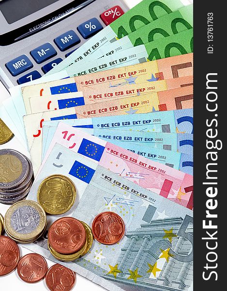 Euro banknotes with coins and calculator. Euro banknotes with coins and calculator