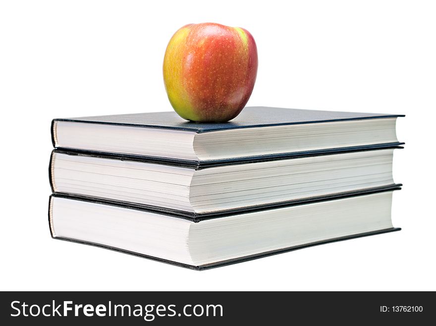 Red-yellow apple and open book isolated on a white background. Red-yellow apple and open book isolated on a white background.