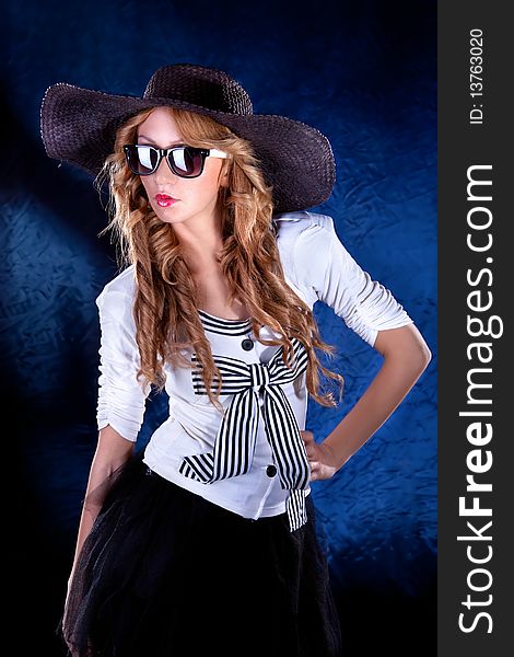 Photo-session of the young beautiful woman with black hat. Photo-session of the young beautiful woman with black hat