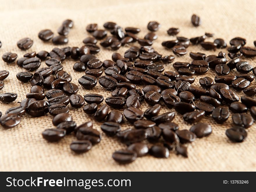 Coffee beans on canvas background