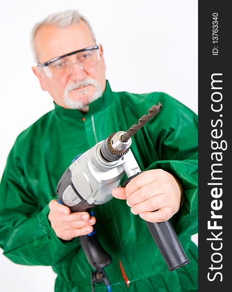 Construction worker holding the electric hand drill. Construction worker holding the electric hand drill