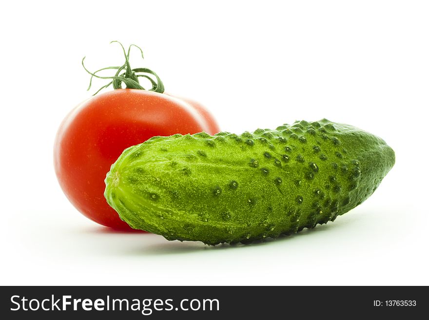 Cucumber and tomato isolated on white