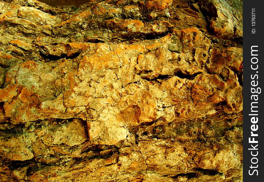 A rough textured Rock surface background. A rough textured Rock surface background