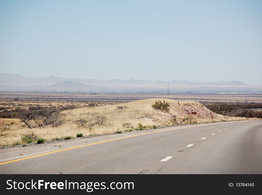 Desert Road with mountains in the background