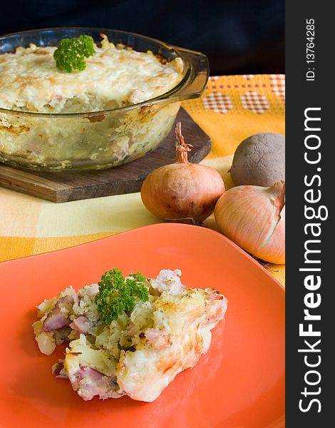 Baked potatoes with cheese and onions