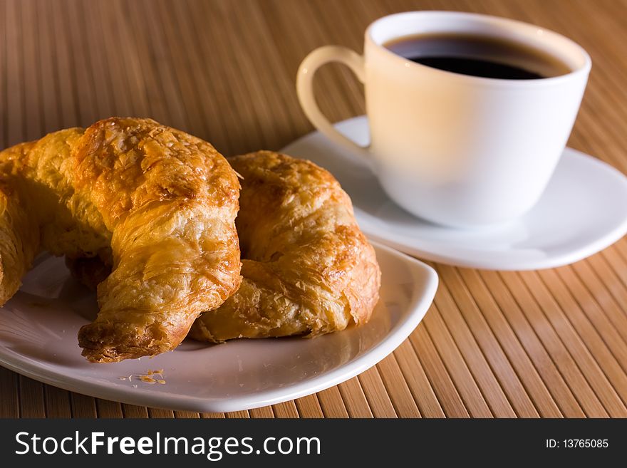 Breakfast with  coffee and croissants.