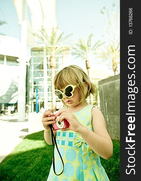 A 5 year old girl, photographed outside in the park. A 5 year old girl, photographed outside in the park.