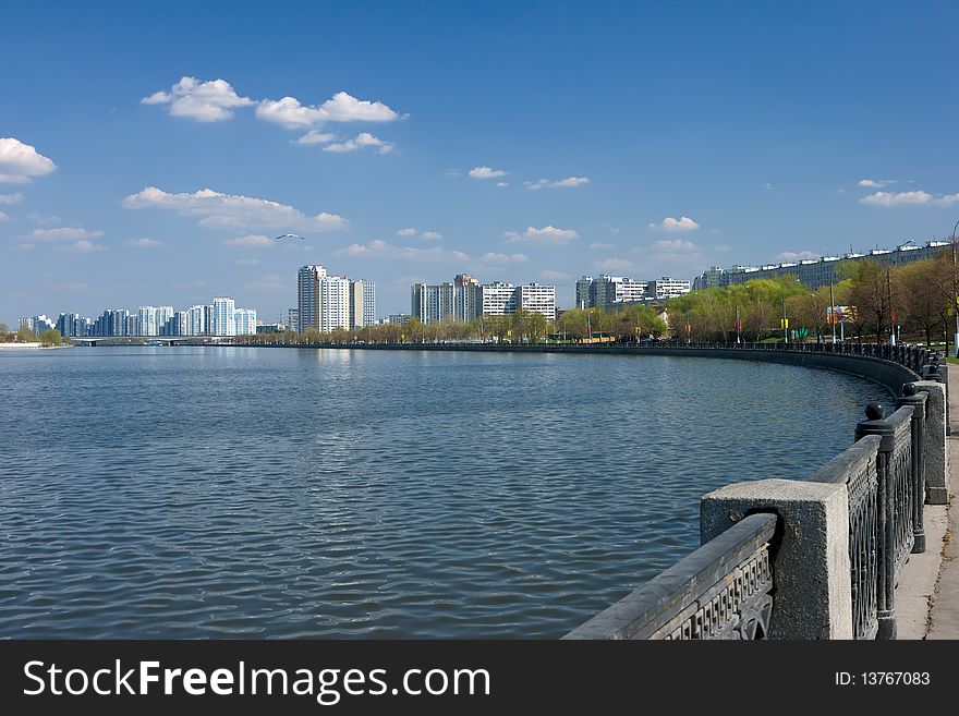 Quay of moscow river with homes on horizon. Quay of moscow river with homes on horizon