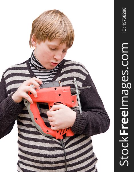 Boy with a fret saw on a white background. Boy with a fret saw on a white background