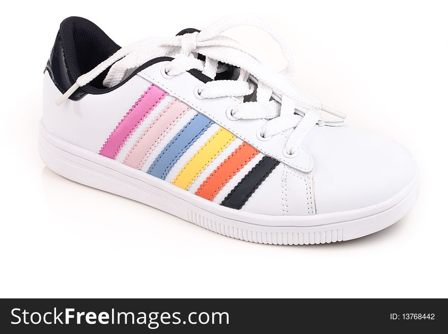 Athletic shoes with colorful stripes on a light background