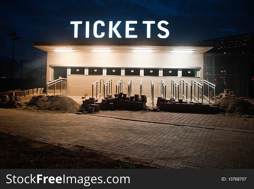 South africa will host the 2010 world cup of soccer. Jewel of the crown is the soccer city in soweto-johannesburg, and the stadoum capable of 80000 people will host the first and final match opf the competition.Here the tickets box under construction with a night light very moody. South africa will host the 2010 world cup of soccer. Jewel of the crown is the soccer city in soweto-johannesburg, and the stadoum capable of 80000 people will host the first and final match opf the competition.Here the tickets box under construction with a night light very moody.