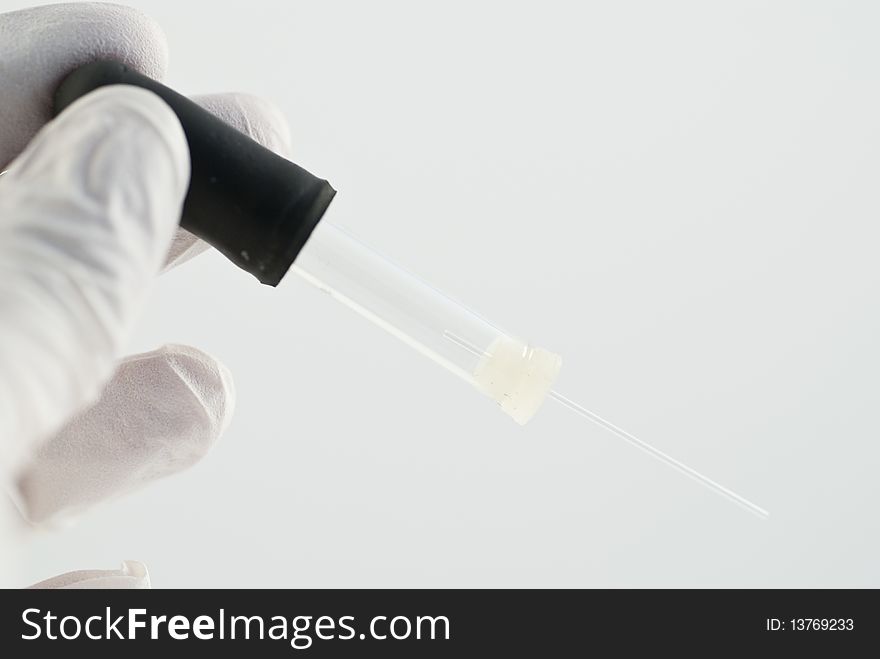 A pipette for capillary blood test in the finger. A pipette for capillary blood test in the finger.