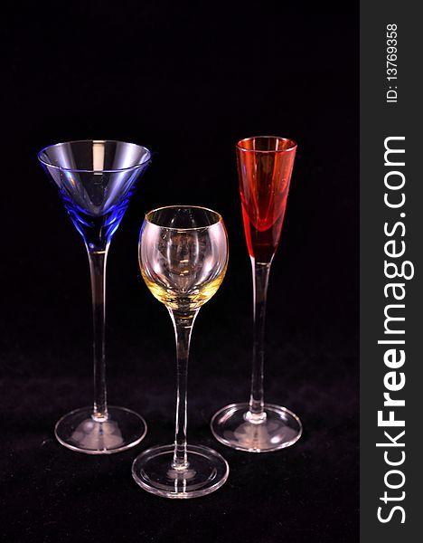 3 drink glasses in primary colors, full view. 3 drink glasses in primary colors, full view