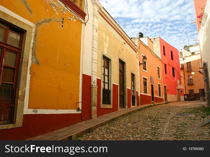 Colorful buildings against sky; street photography, Guanajuato, Mexico. Colorful buildings against sky; street photography, Guanajuato, Mexico.