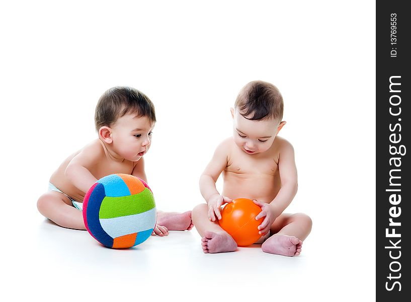 Twin brothers with bright balls isolated on a white background