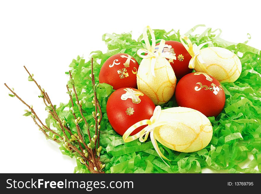 Easter eggs in a green paper on a white background. Easter eggs in a green paper on a white background