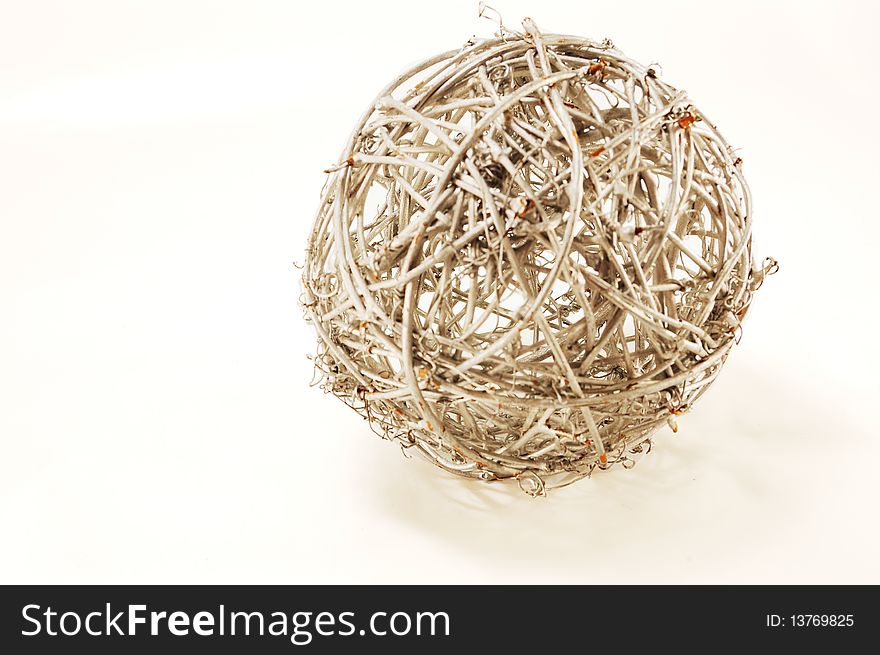 Woven rod big silver ball, isolated on a white background. Woven rod big silver ball, isolated on a white background