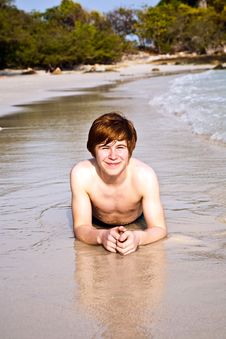 Happy Boy With Red Hair Is Enjoying The Beach Royalty Free Stock Photo
