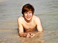 Happy Boy With Red Hair Is Enjoying The Beach Royalty Free Stock Photography
