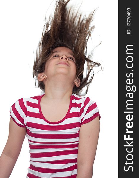 Young girl with her hair blowing in the air on a white background