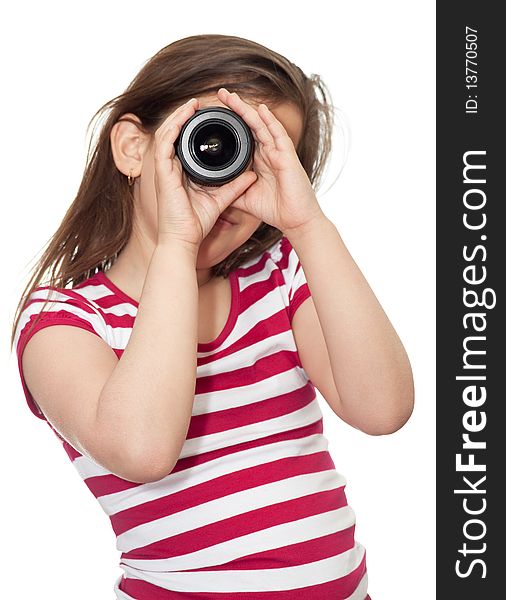 Young girl looking through a camera lens on a white background