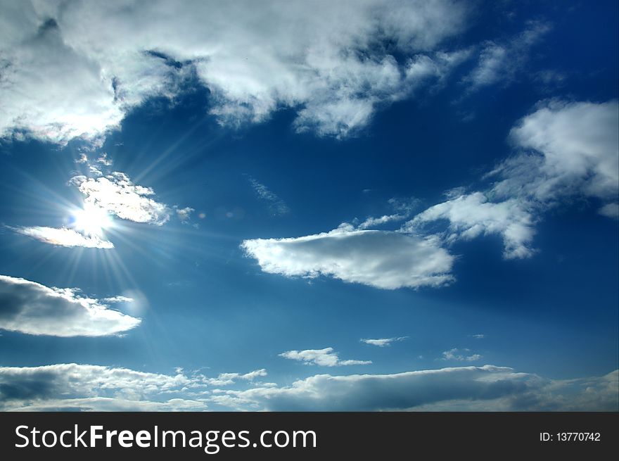 Beautiful blue sky with shining sun and many white clouds. Beautiful blue sky with shining sun and many white clouds