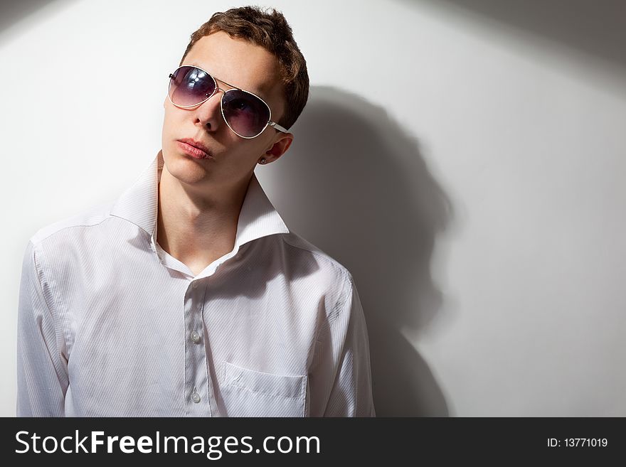 Portrait of young handsome man in sunglasses