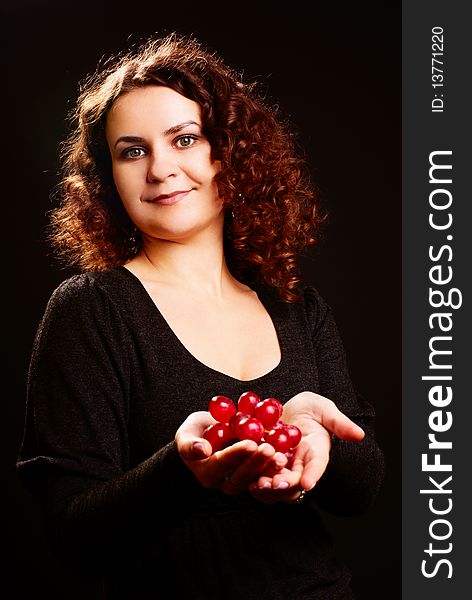 Portrait of young beautiful woman with grapes on her hands. Portrait of young beautiful woman with grapes on her hands.