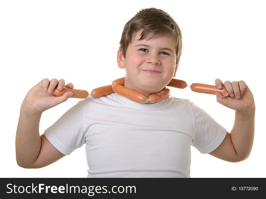 Happy boy has wrapped up sausages round neck isolated in white