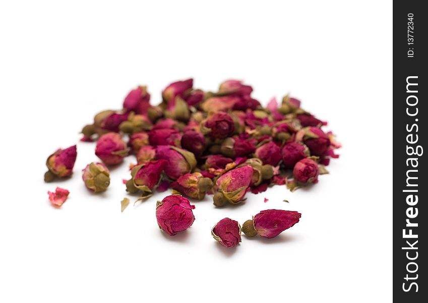 Natural dried rose tea isolated on white background