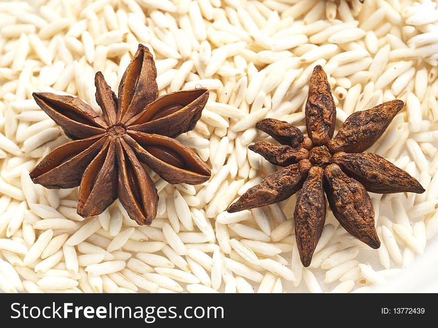 Star-aniseeds with raw fried rice in the backdrop