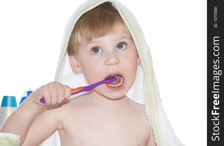 The little boy cleans a teeth on a white background. The little boy cleans a teeth on a white background