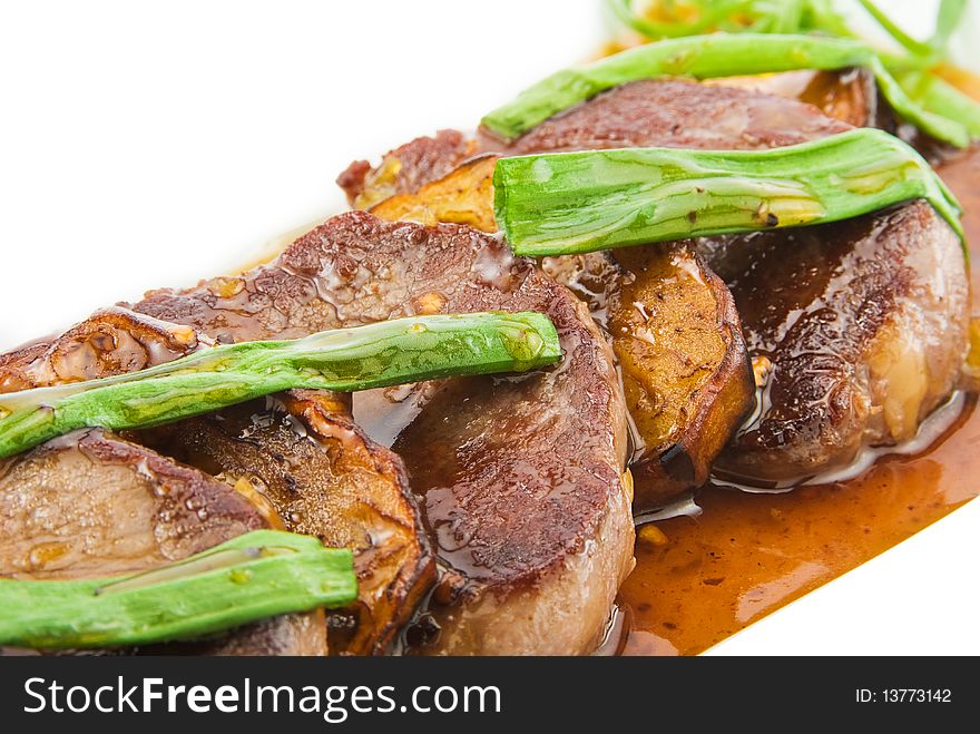 White plate with beef and aubergine isolated